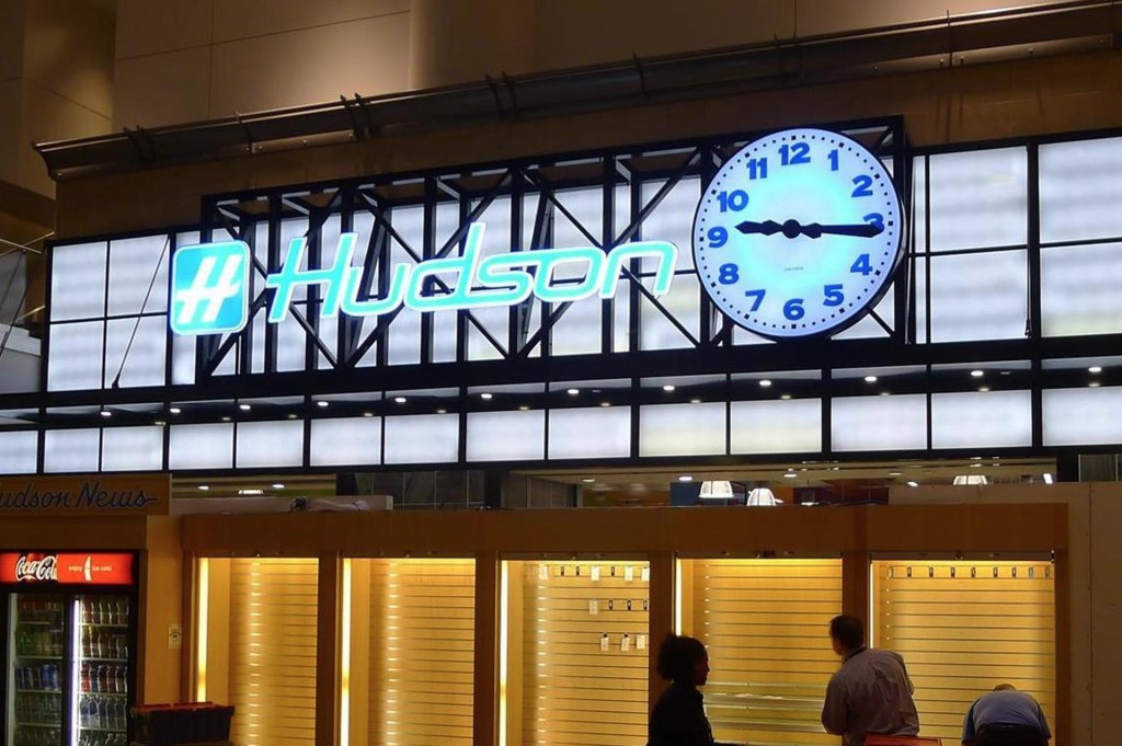 Airport terminal storefront illuminated automatic 60-inch canister clock by Lumichron