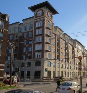 The Orion Apartment Building and Mixed-Use Development, St. Louis, MO,m with clock tower - Inset canister Illuminated fully automatic 84-inch clocks by Lumichron