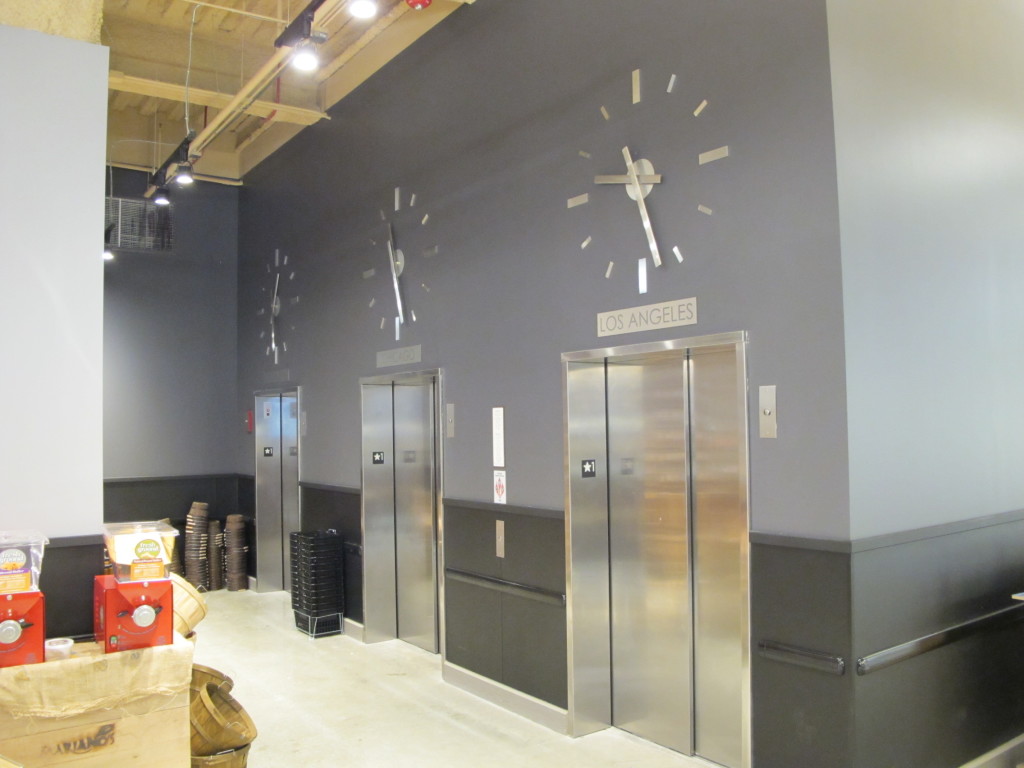 Skeletal marker silhouette elevator clocks by Lumichron