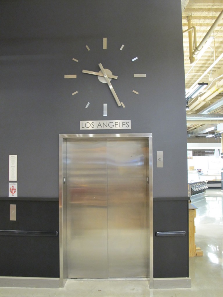 Skeletal marker silhouette elevator clock by Lumichron