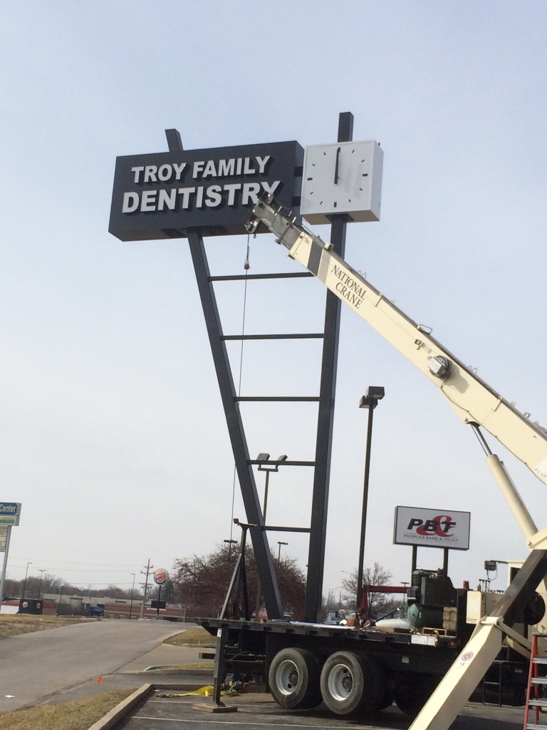 Installation of 2-sided Clock on the sign structure for Troy Dentistry Big sign clock made with parts from Lumichron