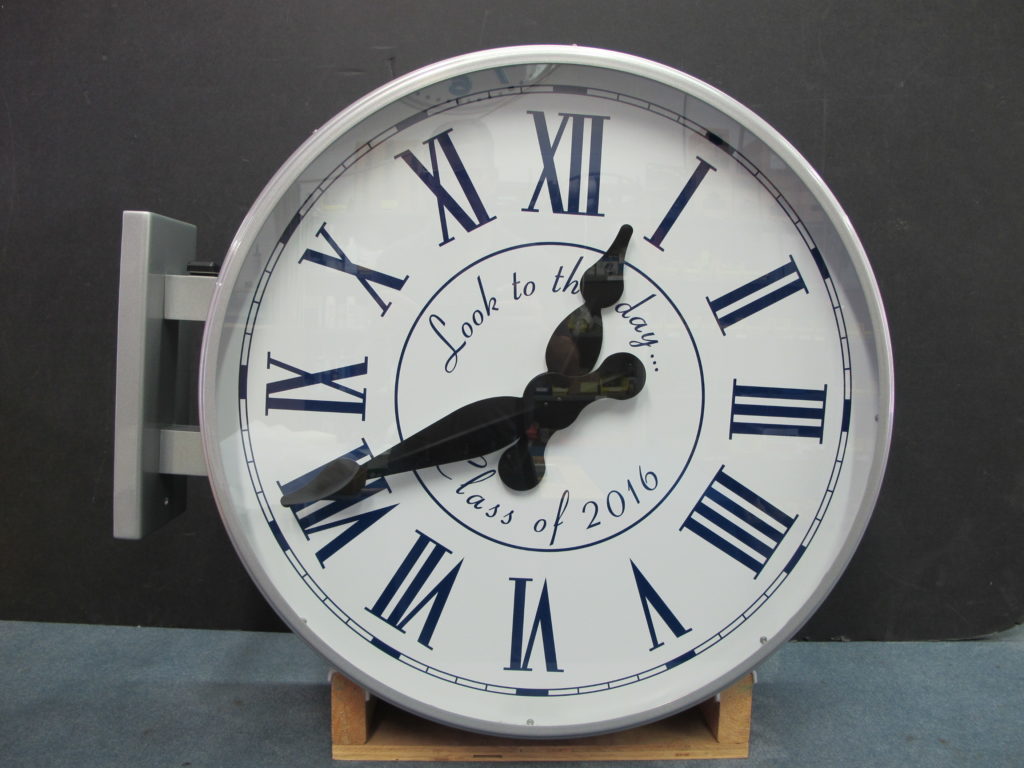Bracket clock showing roman numeral dials with custom text interior 