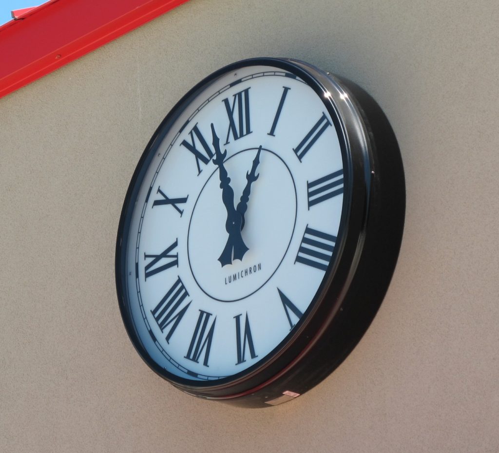 Surface mounted clock with Roman Numeral Hour Markers