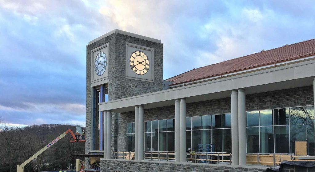 This image shows a Clock Tower construction in progress at James Madison University with 15- clocks built and installed by Lumichron