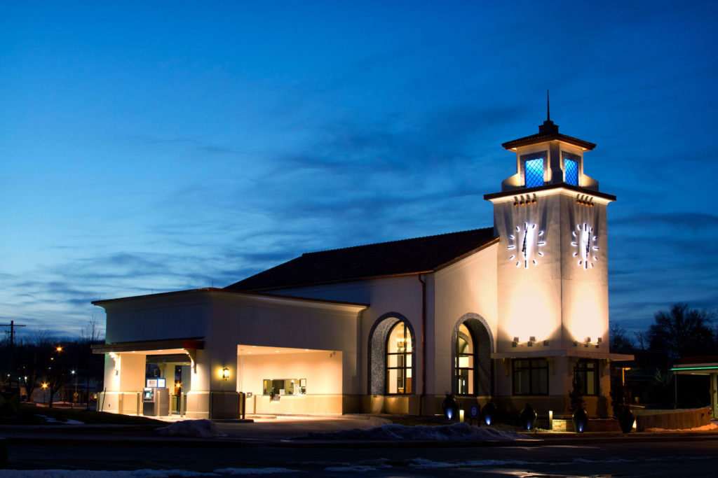 Dusk at a Bank with a pair of halo-lit Skeletal marker silhouette 108-inch Clocks by Lumichron