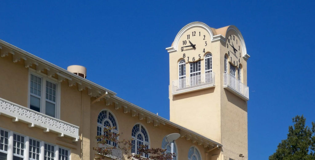 Clock tower with skeletal clocks at Tamalpais High School by Lumichron