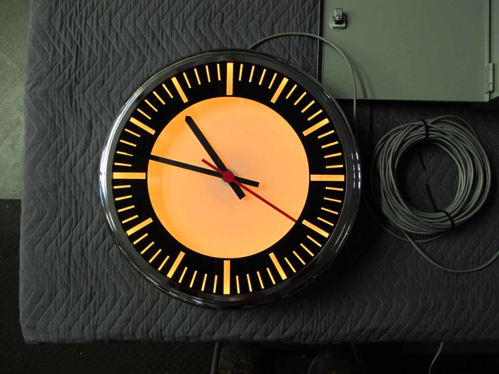 An 18-inch self-setting illuminated black and chrome clock for Skyline Diner, Washington DC by Lumichron