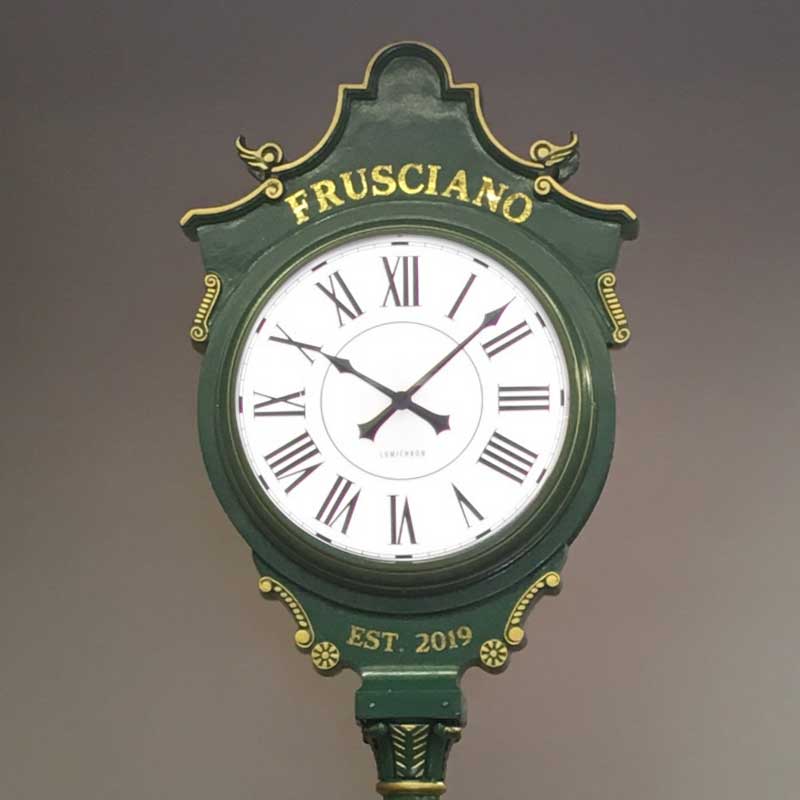 Post clock with custom exterior and roman numeral clock dials