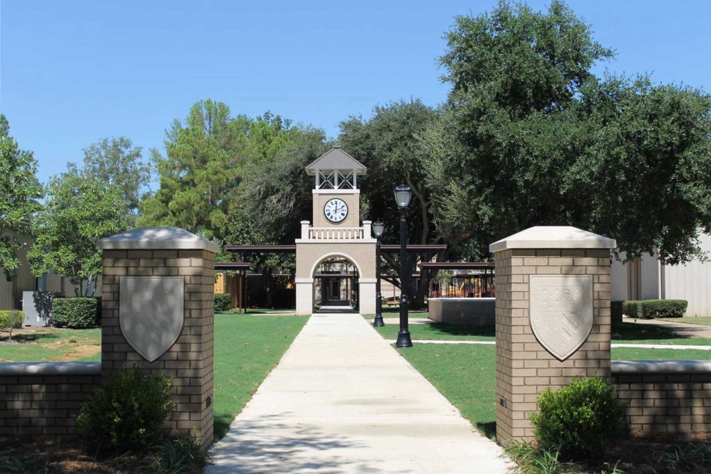 Brick entryway clock tower with a 60-inch surface-mounted illuminated clock at Jackson Prep MS by Lumichron