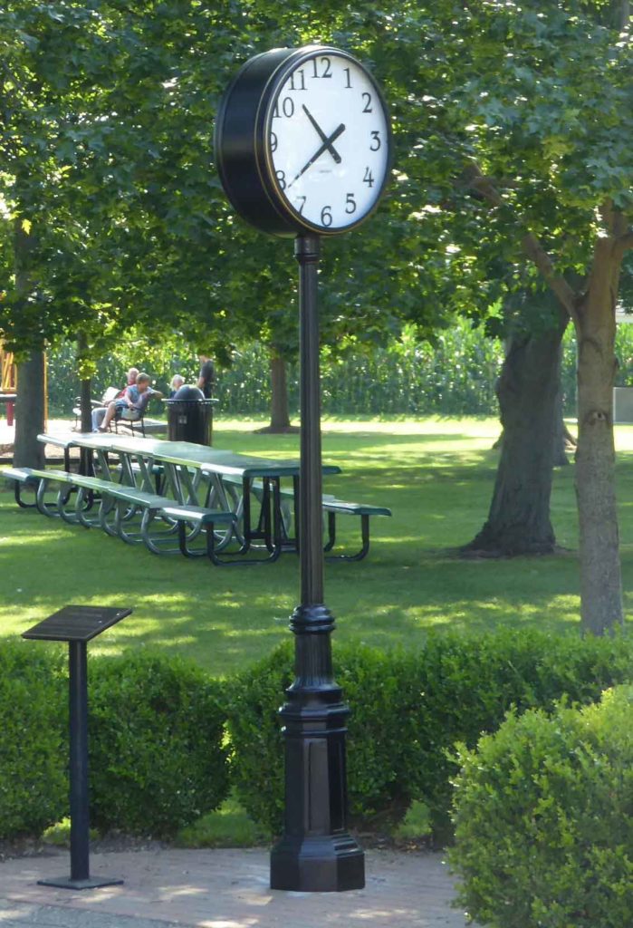 Black and gold Post Street Streetscape 24in Clock installed in Drenthe Park, Holland Michigan by Lumichron