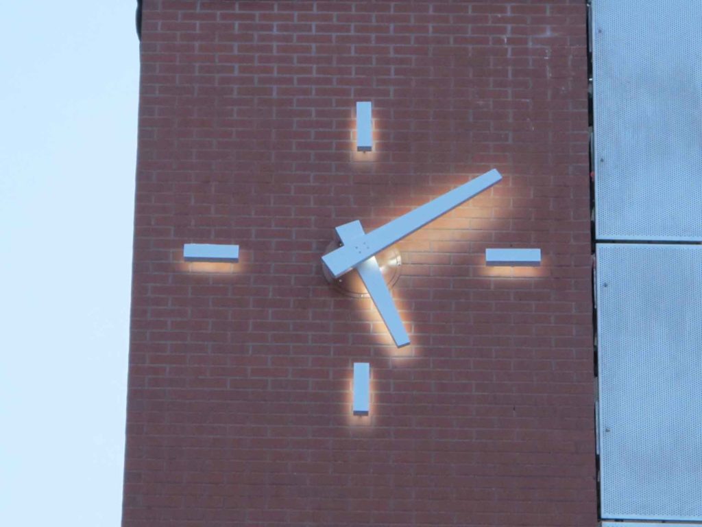 SKELETAL Lumichron illuminated 72-inch diameter skeletal clock on a brick tower GR Amtrak Station