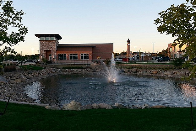 The Fountains in Cedar Rapids, Iowa, a shopping center with a water fountain focal point and a clock tower and a bell tower with Westminster Chimes