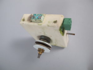 A MOBATIME Nu-90t impulse-drive clock movement, that still works despite the water damage and mold!