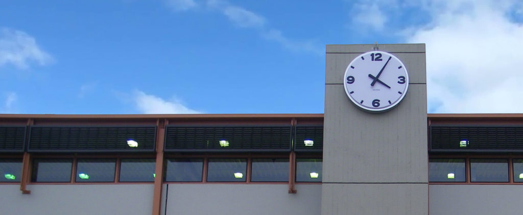 72-inch diameter Surface Mount Tower Clock by Lumichron, installed at the Bay Area Transit Pleasantville Station, San Francisco California. Clock face with a 12, 3, 6, 9 vacuuformed embossed polycarbonate, illuminated