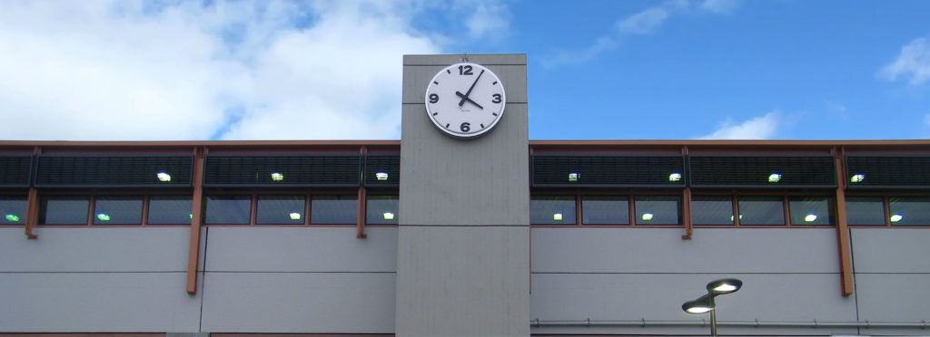 72-inch diameter Surface Mount Tower Clock by Lumichron, installed at the Bay Area Transit Pleasantville Station, San Francisco California. Clock face with a 12, 3, 6, 9 vacuuformed embossed polycarbonate, illuminated