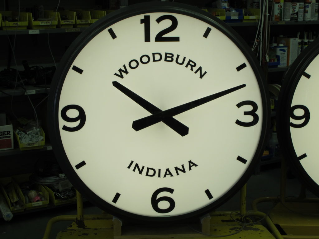 a 42-inch diameter custom tower clock made by Lumichron Commercial Clocks for the memorial clock tower in Woodburn Indiana.j  Custom Dial with Modern Arabic numbers and Straight Tapered Hour and Minute Hands. Clock dial is illuminated. Clock is one of a set of four (4).