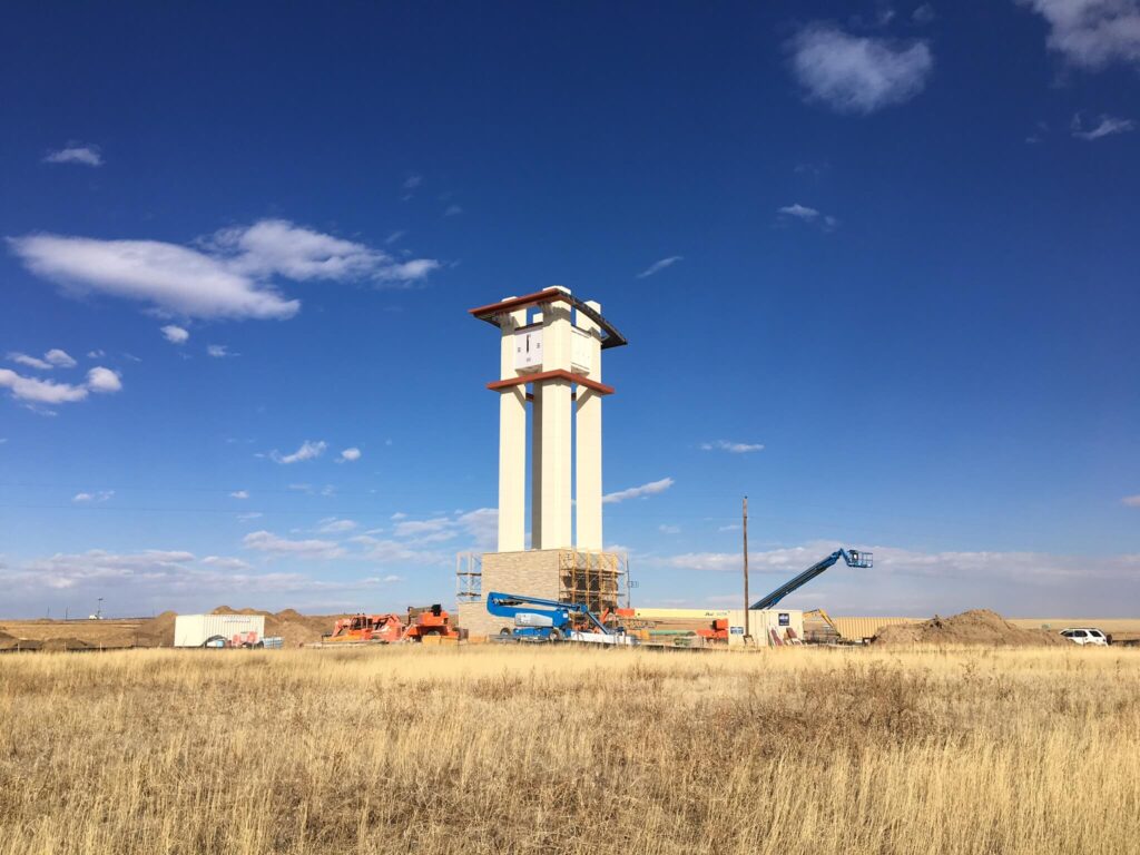 Construction in progress of the Aurora Highlands 110′ high tower clock.