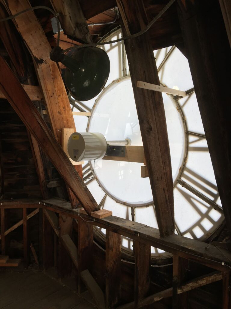 A view of one of the eight-feet diameter clock dials from inside the clock tower. New glazing, and new clock movment.  