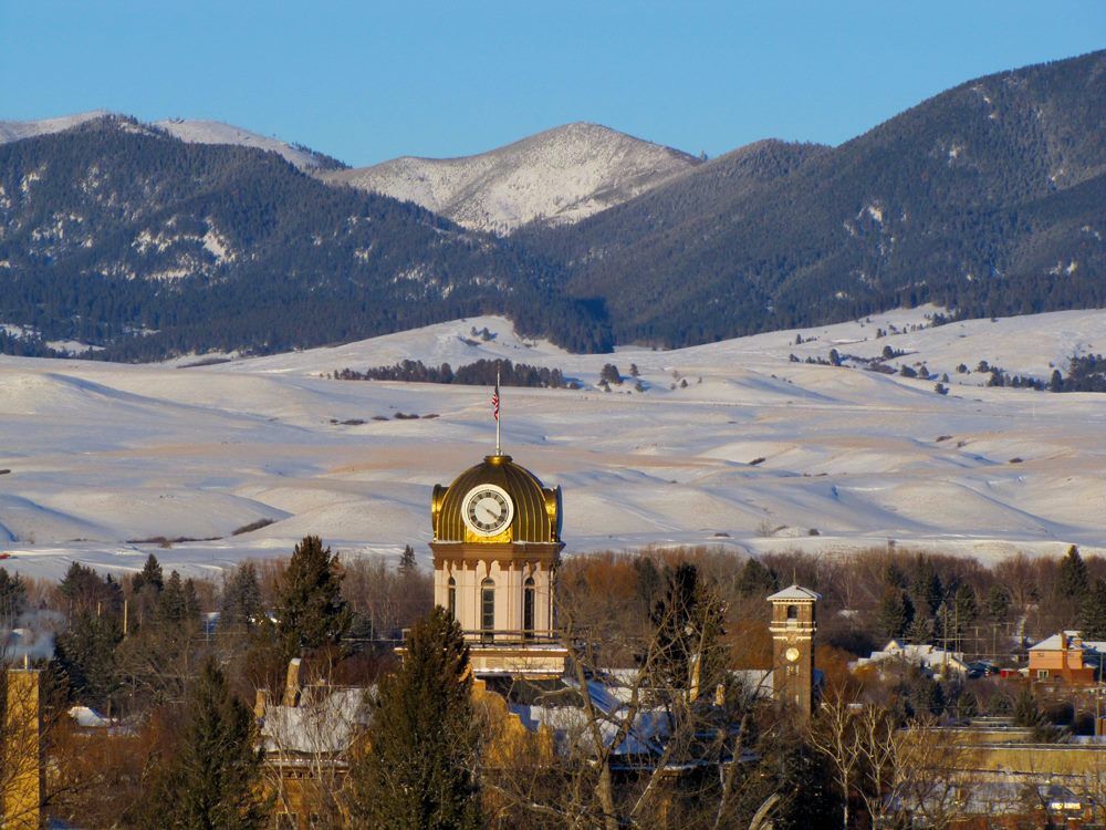 Big Sky County. View of the mountain range with the Fergus County Courthouse in the foreground.  Lewistown, Montana