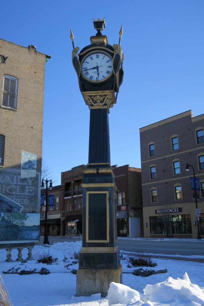 DeKalb Rotary - This is a Street Clock in the snow, in the city of DeKalb Illinois.  2021 is the centennial for the Soldiers and Sailors WWI Veterans Tribute -Memorial Clock