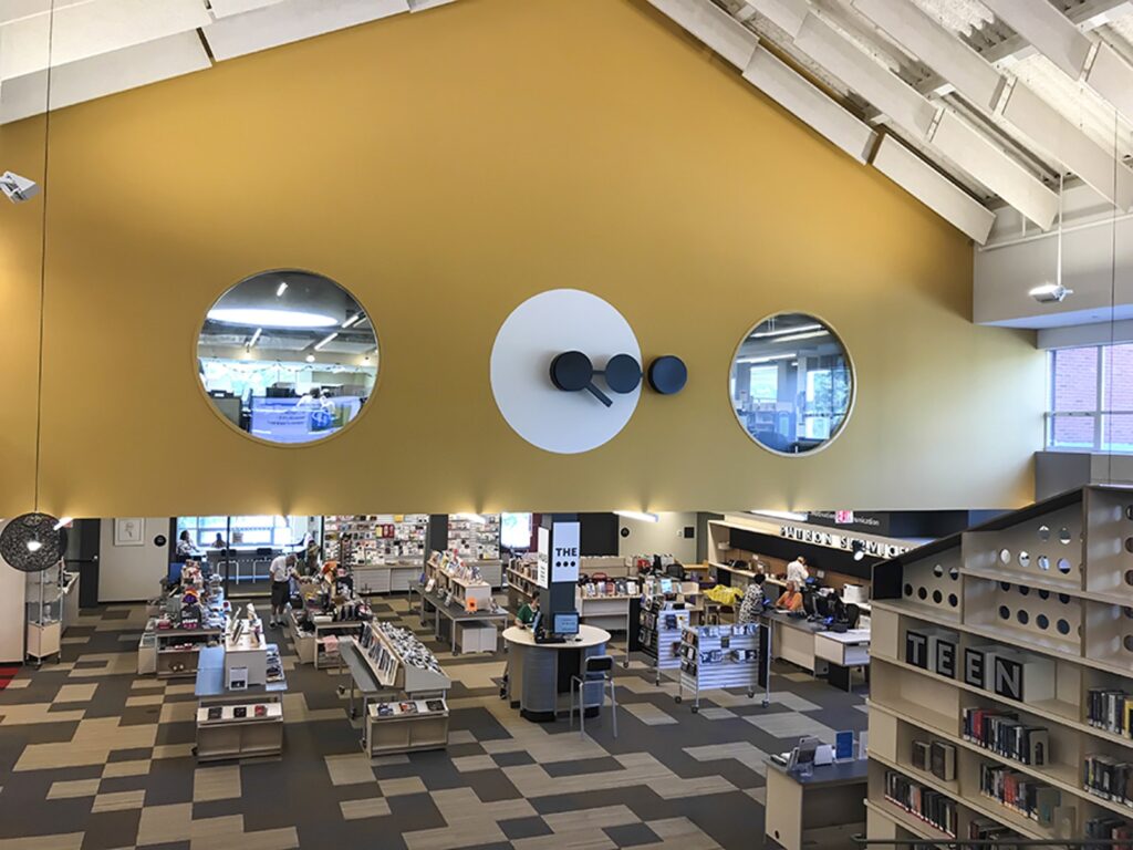 Westport Library ellipses special clock design by Alexander Isley manufactured by Lumichron Automatic time control Lumichron large indoor wall clock
