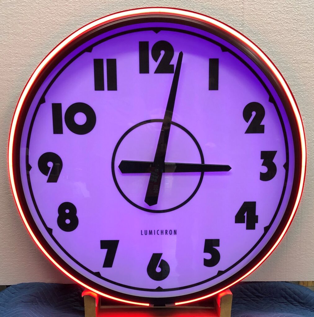 LUMICHRON Lamp theatre color changing LED clock featuring the Pantone Color of the Year for 2022, veri peri.  