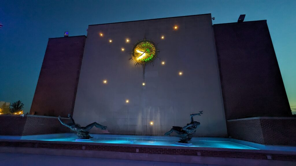 photo of the Night and Day Fountain and  gold illuminated Sculpture Clock for McMorran Auditorium. Sculptor Marshall Fredericks.