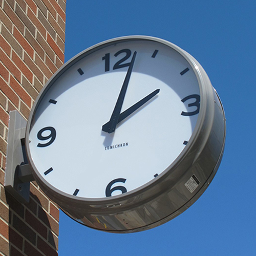 Double faced bracket clock showing hour markers